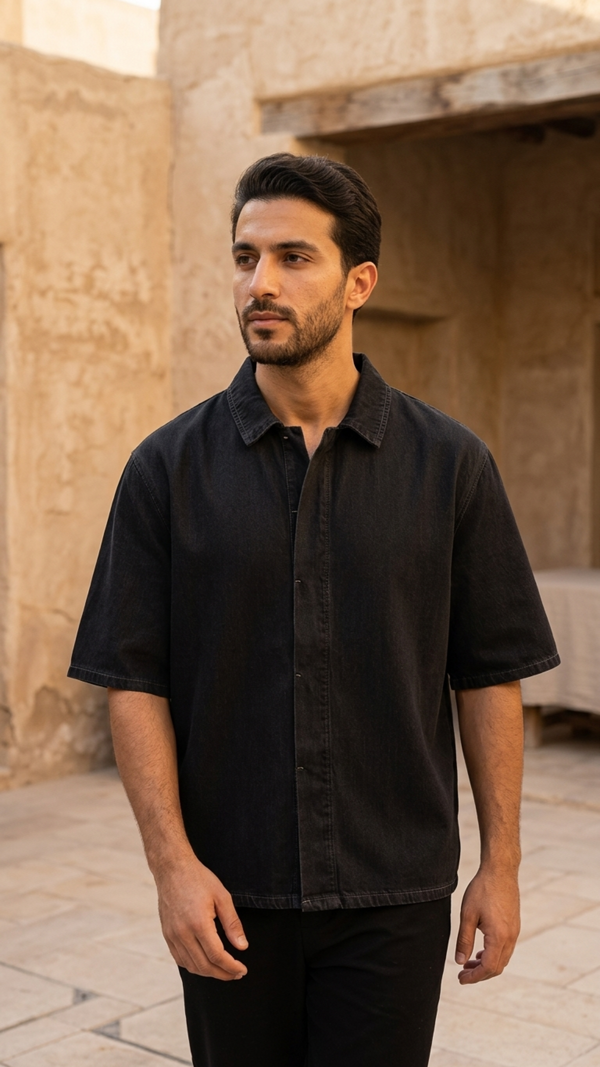 Black unisex drop-shoulder lyocell shirt with short sleeves and button-front