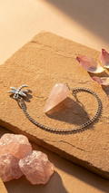 Rose quartz pendulum bag charm with chain and small floral connector, pink stone