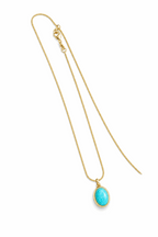 Gold oval Larimar pendant necklace with blue stone on chain