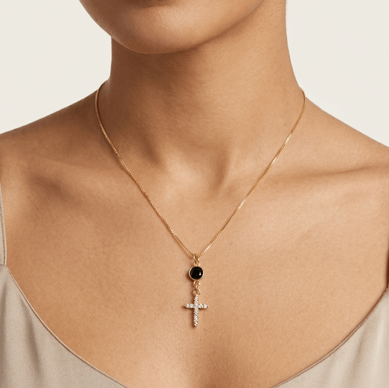Gold-tone cross pendant necklace with black zircon charm and small crystal cross