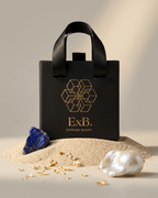 Gold-tone opal pendant necklace in black gift pouch, blue sunburst stone