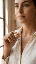 Gold chain necklace with blue opal sunburst pendant