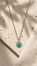 Gold-plated flake chain necklace with blue cabochon opal pendant
