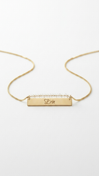 Gold beaded bar name necklace with engraved rectangular nameplate on a short chain